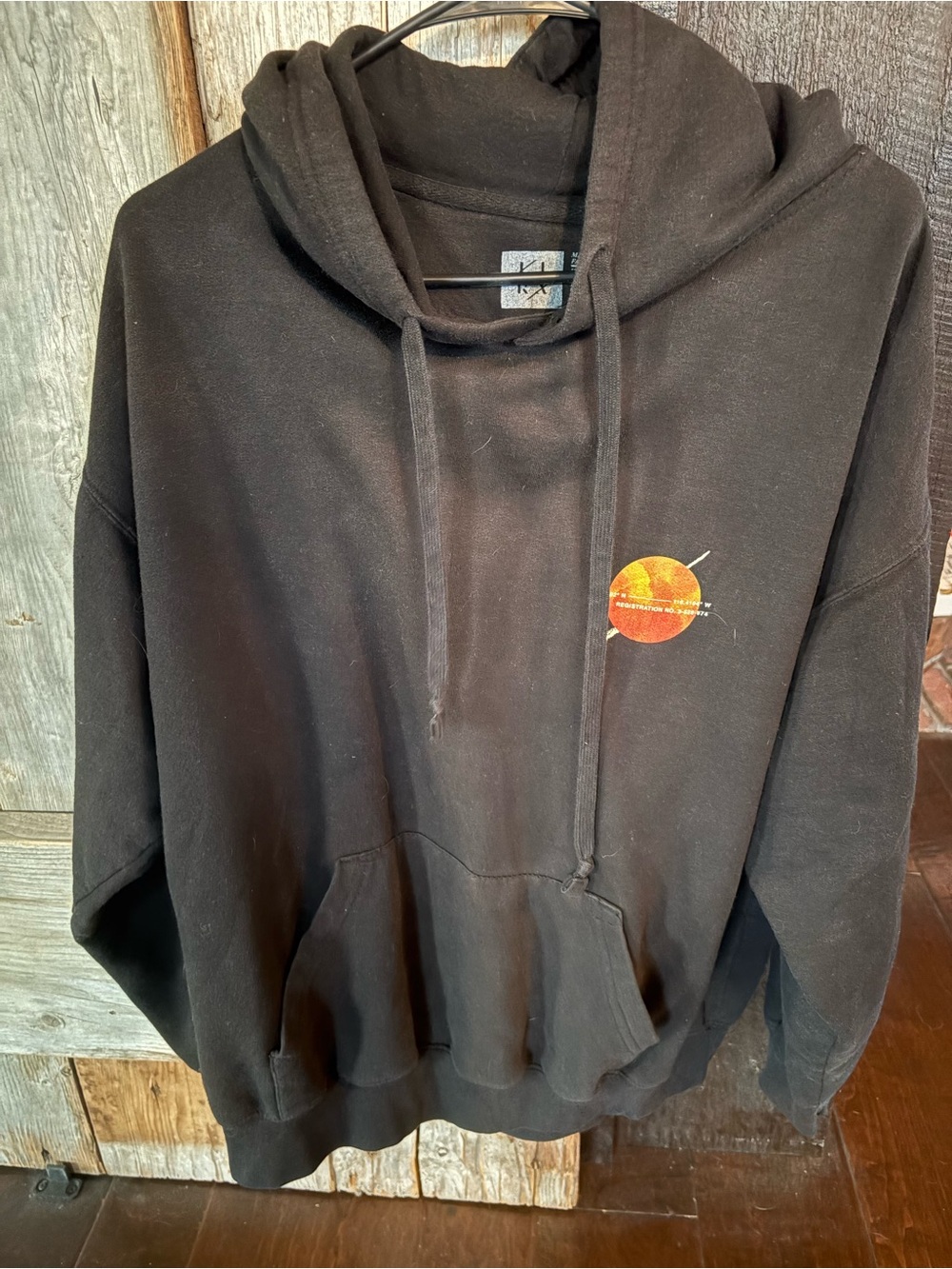 Lira Black Hoodie Sweater with Orange Solar Graphic